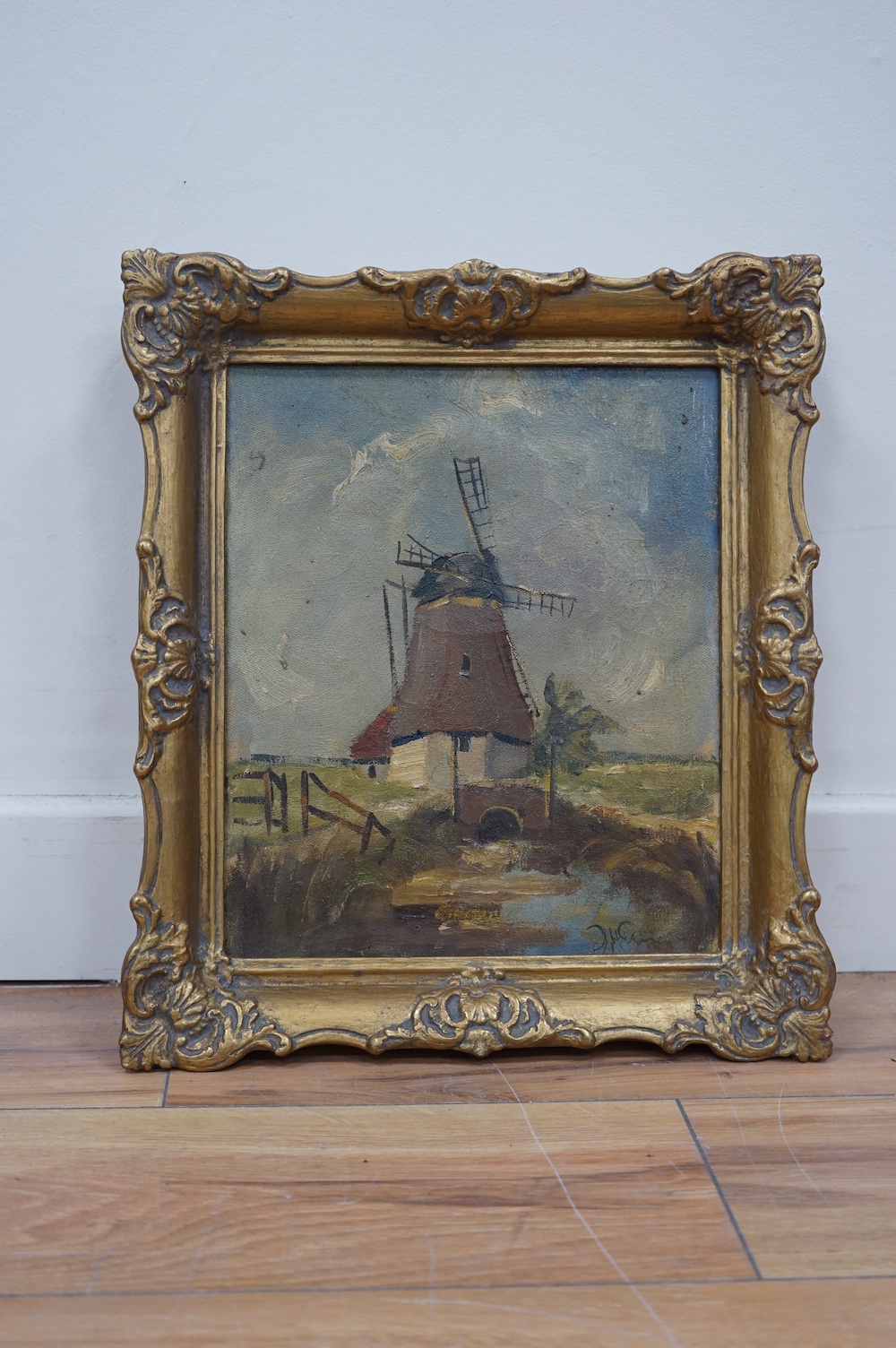 German School, oil on canvas, Study of a windmill, indistinctly signed lower right, 28 x 23cm, ornate gilt frame. Condition - fair, would benefit from a clean